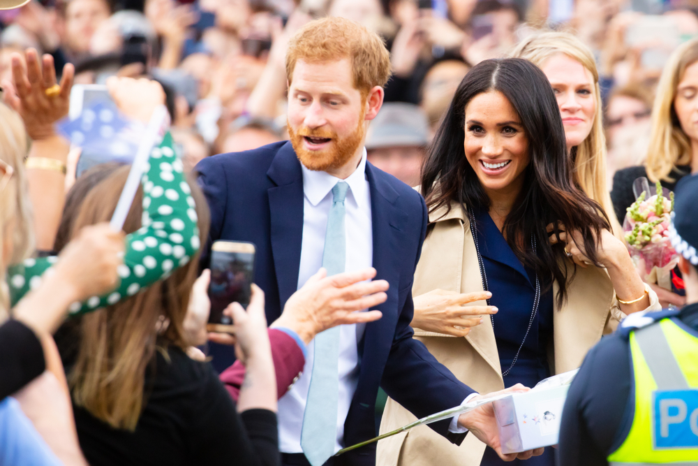 MELBOURNE, AUSTRALIA - OCTOBER 18: Prince Harry, Duke of Sussex and Meghan Markle, Duchess of Sussex meet fans at Government House in Melbourne, Australia 