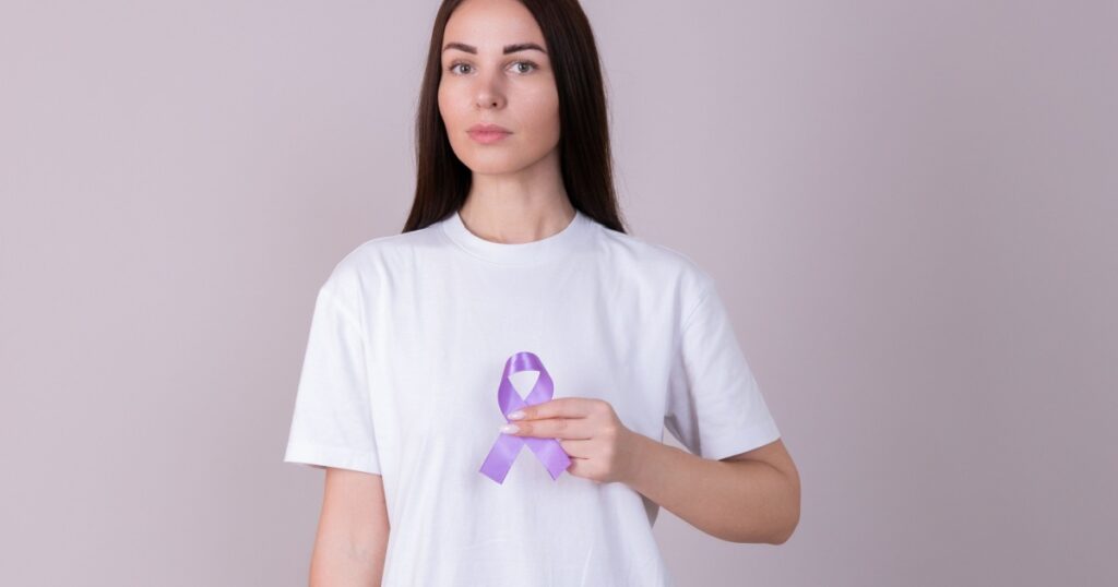 Woman holding a purple ribbon in her hands