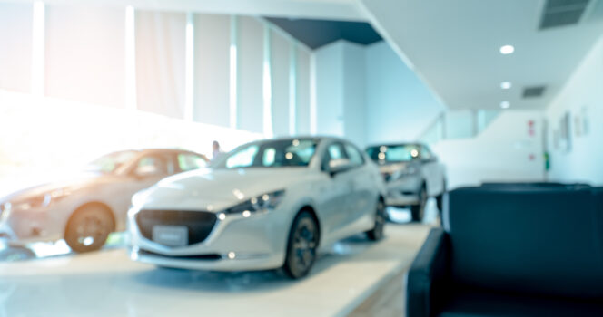 Modern car in dealership. Credit: Shutterstock