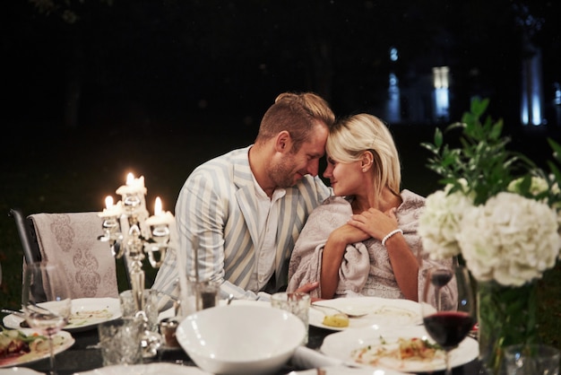 Beautiful adult couple have a luxury dinner at evening time