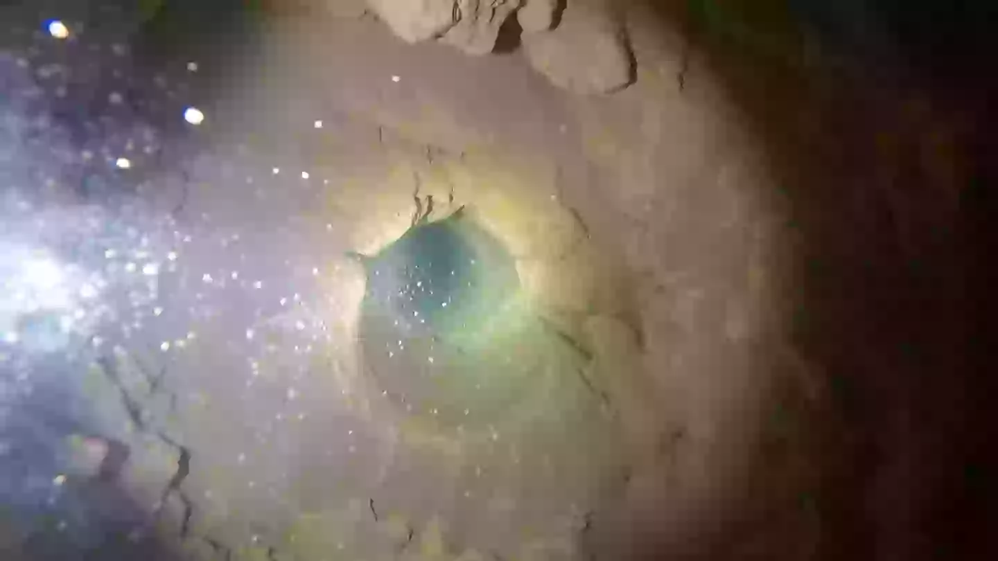 At the bottom you're greeted with the eerie darkness of groundwater (YouTube/Andy Wende)