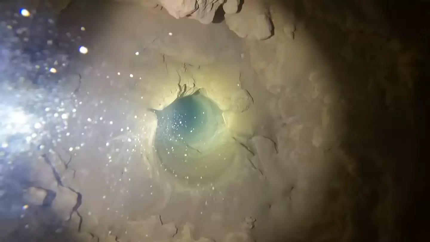 At the bottom you're greeted with the eerie darkness of groundwater (YouTube/Andy Wende)