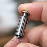 Found this in a box of kitchen gadgets. It’s a long metal tube with a plunger at the top. When I push it, tiny claws come out the bottom.