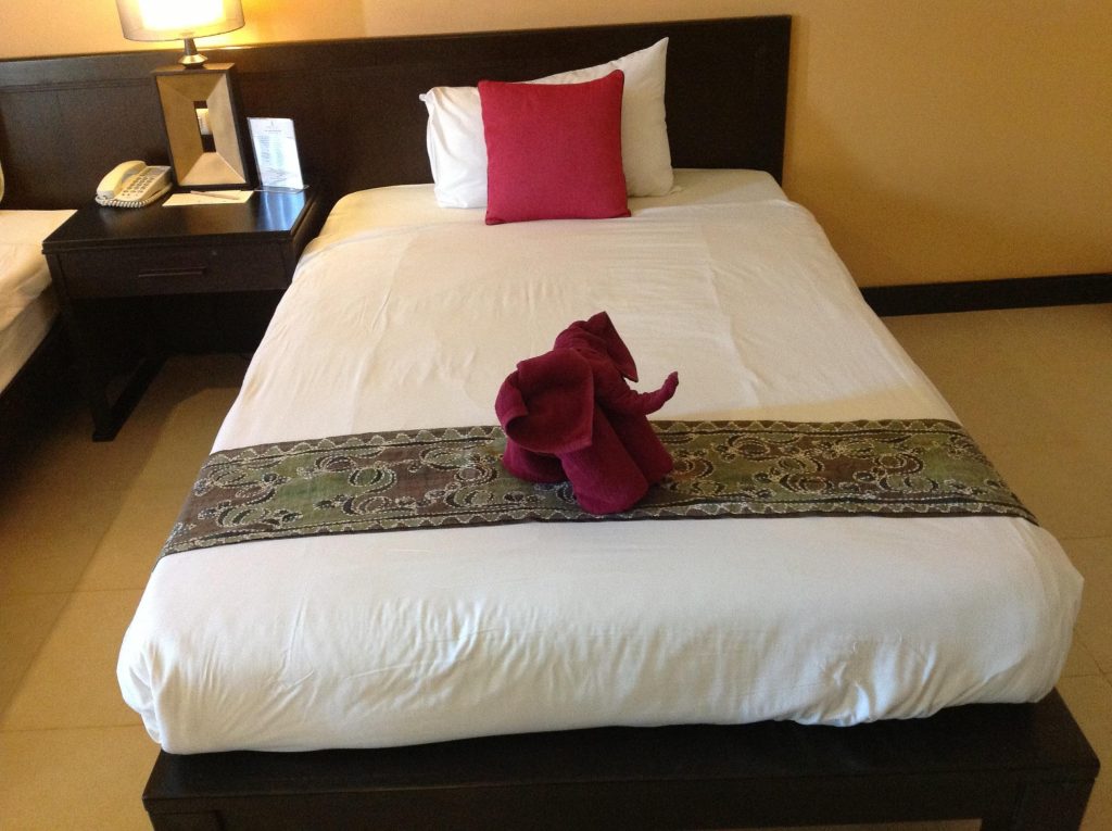 Why Do Hotels Put a Cloth Across the Bed?
