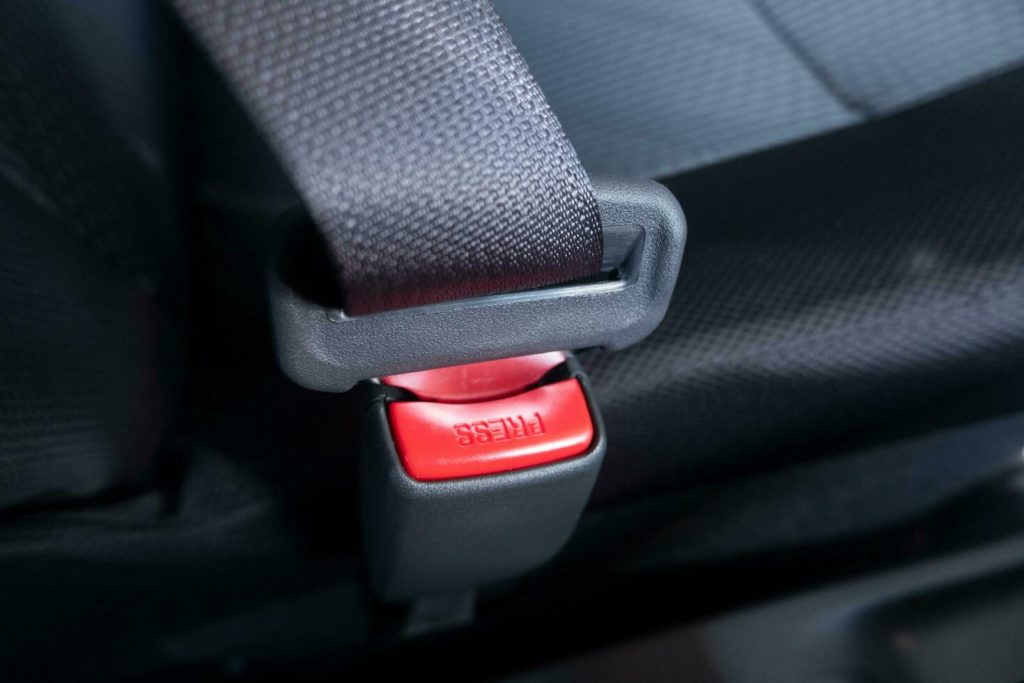 What Does the Little Button on a Seat Belt Actually Do?