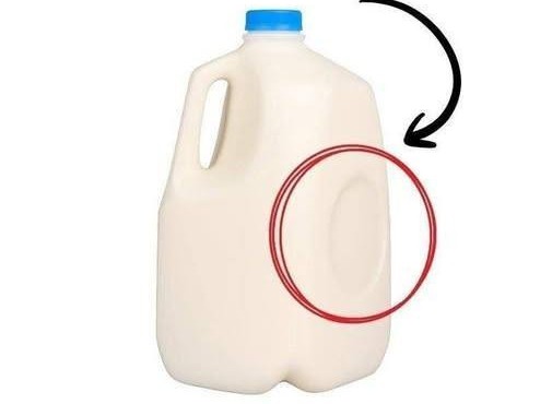 Why Plastic Milk Jugs Have That Small Circular Dent