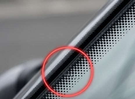 Most Drivers Have No Idea What the Little Black Dots on a Windshield Actually Do