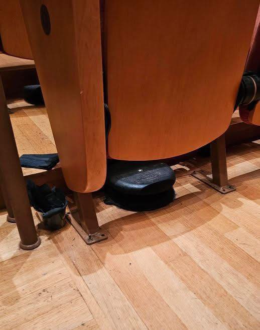 The Hidden Feature Under Old Theater Seats That Helped Keep Audiences Cool