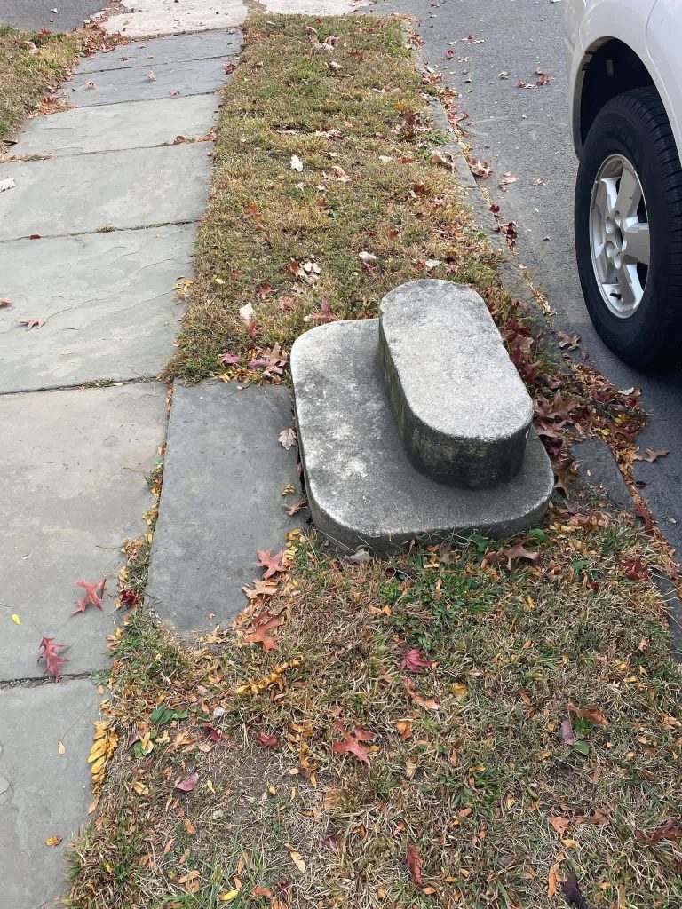 Not Just a Rock: The Surprising Historical Purpose of Those Odd Stones in the Sidewalk