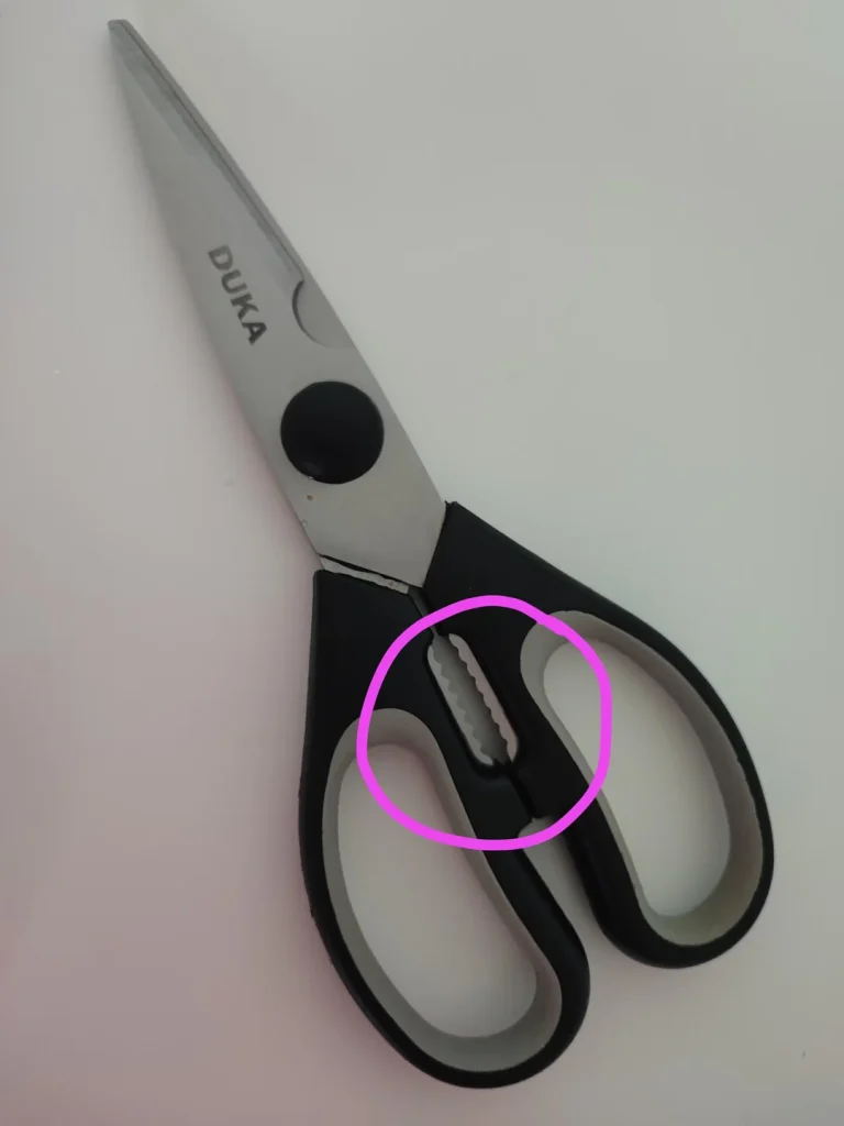 What Is That Serrated Part Between the Handles of Kitchen Scissors?