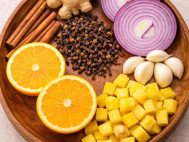 Homemade Herbal Infusion with Cinnamon, Cloves, Garlic, Ginger, Lemon, and Onion